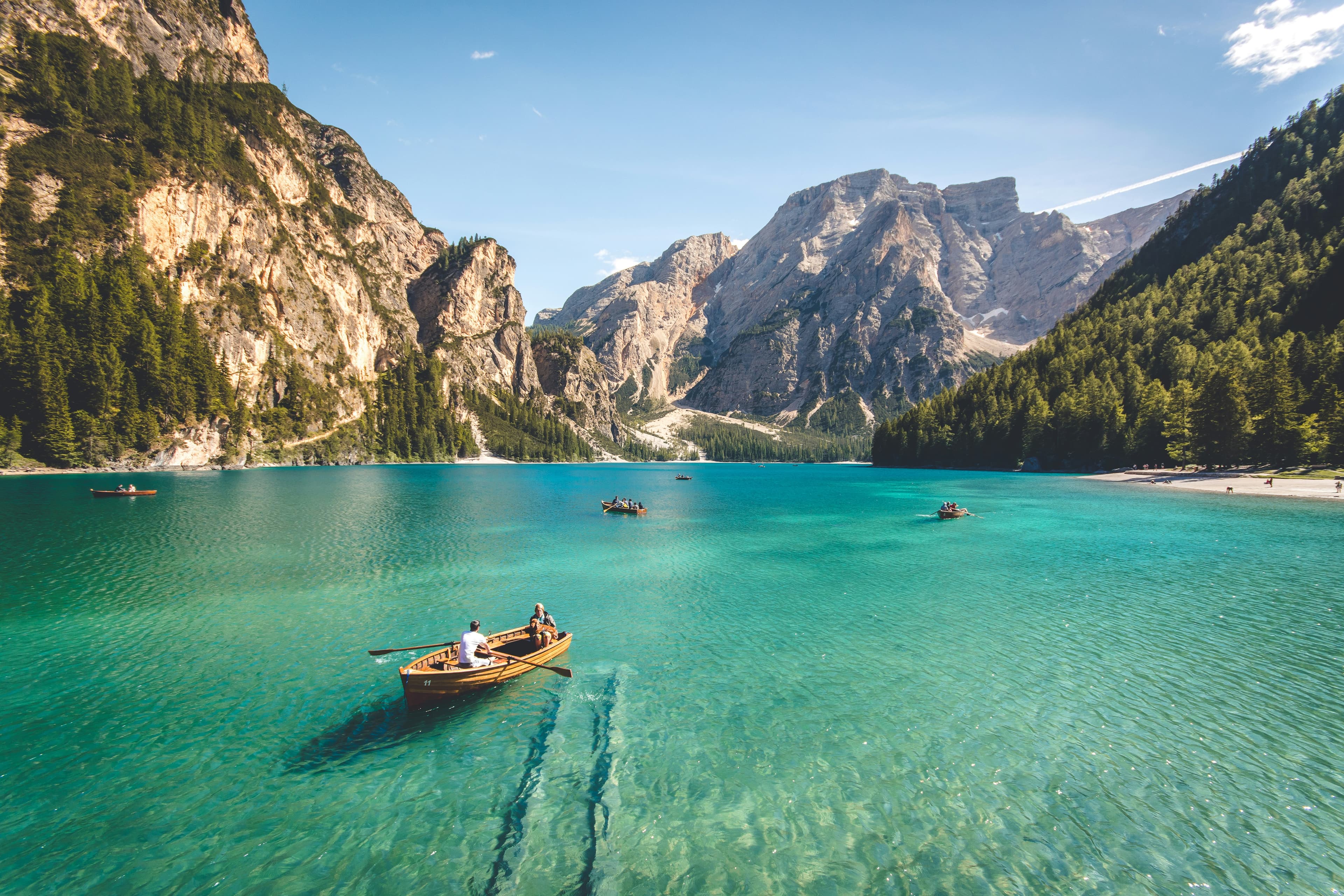 Travellers exploring a mountain lake